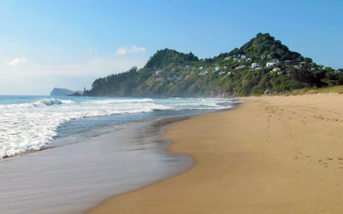 The golden sand beach in Tairua. House in New Zealand is privately sold